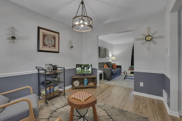 13680 Nantucket Ave NW, Pickerington, OH 43147 - living area featuring wood finished floors and a chandelier