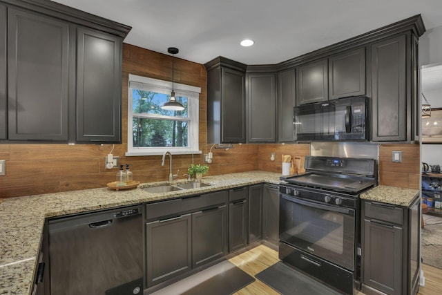 13680 Nantucket Ave NW, Pickerington, OH 43147 - kitchen featuring black appliances, tasteful backsplash, light wood-style floors, light stone counters, and recessed lighting