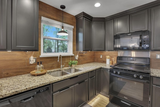 13680 Nantucket Ave NW, Pickerington, OH 43147 - kitchen with black appliances, a sink, backsplash, light stone countertops, and pendant lighting