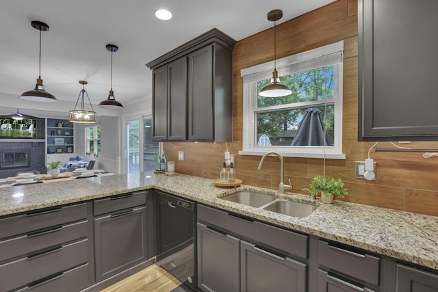 13680 Nantucket Ave NW, Pickerington, OH 43147 - kitchen with dishwasher, a sink, decorative backsplash, light stone countertops, and recessed lighting