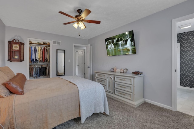 13680 Nantucket Ave NW, Pickerington, OH 43147 - bedroom with a closet, light carpet, ceiling fan, baseboards, and a spacious closet