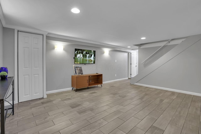 13680 Nantucket Ave NW, Pickerington, OH 43147 - finished below grade area with baseboards, crown molding, recessed lighting, and light wood-style flooring