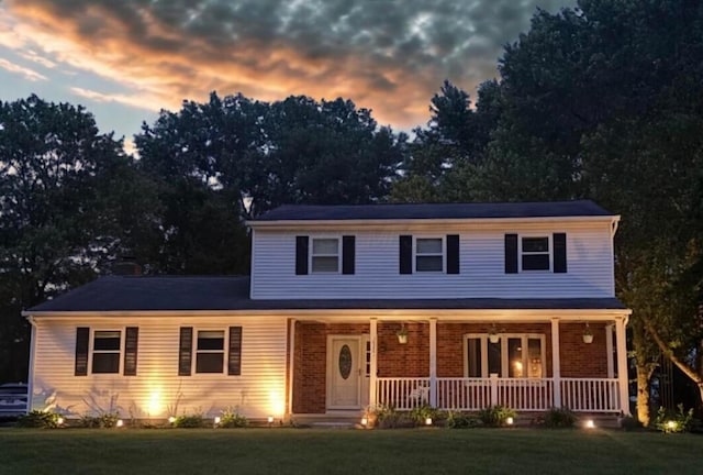 13680 Nantucket Ave NW, Pickerington, OH 43147 - view of front of home featuring covered porch and a front lawn