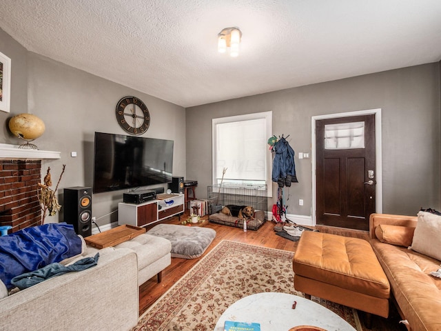 1364-1366 S 3rd St, Columbus, OH 43207 - living room with wood finished floors, a textured ceiling, and healthy amount of natural light