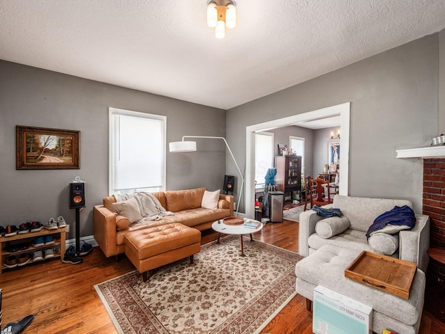 1364-1366 S 3rd St, Columbus, OH 43207 - living area featuring wood finished floors and a textured ceiling