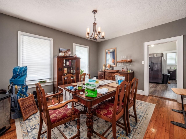 1364-1366 S 3rd St, Columbus, OH 43207 - dining room with a chandelier, hardwood / wood-style floors, and baseboards