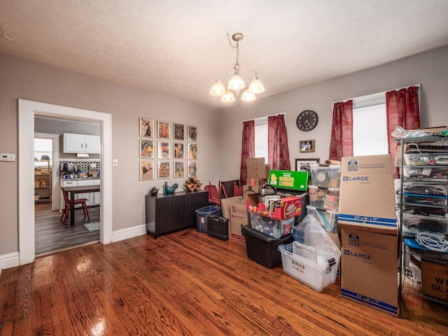1364-1366 S 3rd St, Columbus, OH 43207 - dining space with a chandelier, healthy amount of natural light, wood finished floors, and baseboards