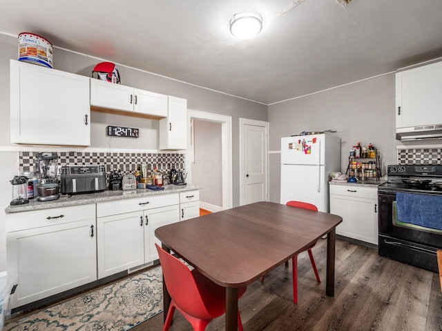 1364-1366 S 3rd St, Columbus, OH 43207 - kitchen featuring black range with electric cooktop, freestanding refrigerator, under cabinet range hood, dark wood-style flooring, and backsplash