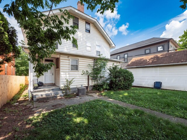 1364-1366 S 3rd St, Columbus, OH 43207 - rear view of house with a chimney and central air condition unit