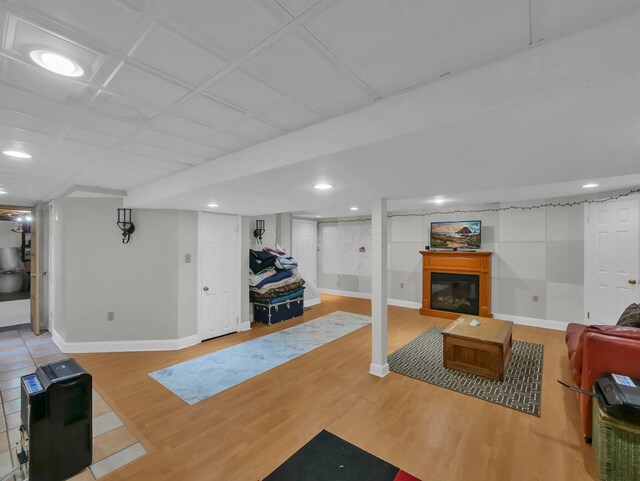 832 Lynnfield Dr, Westerville, OH 43081 - living area featuring a glass covered fireplace, wood finished floors, and recessed lighting