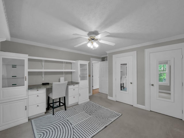 832 Lynnfield Dr, Westerville, OH 43081 - office area with built in desk, ceiling fan, light colored carpet, crown molding, and a textured ceiling