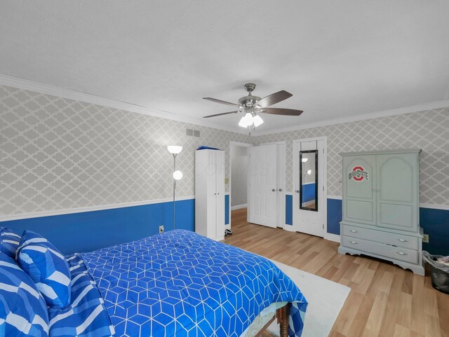 832 Lynnfield Dr, Westerville, OH 43081 - bedroom with wallpapered walls, wood finished floors, crown molding, and ceiling fan