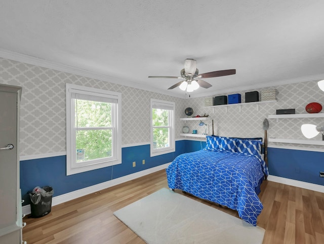 832 Lynnfield Dr, Westerville, OH 43081 - bedroom with ornamental molding, wood finished floors, wallpapered walls, and ceiling fan