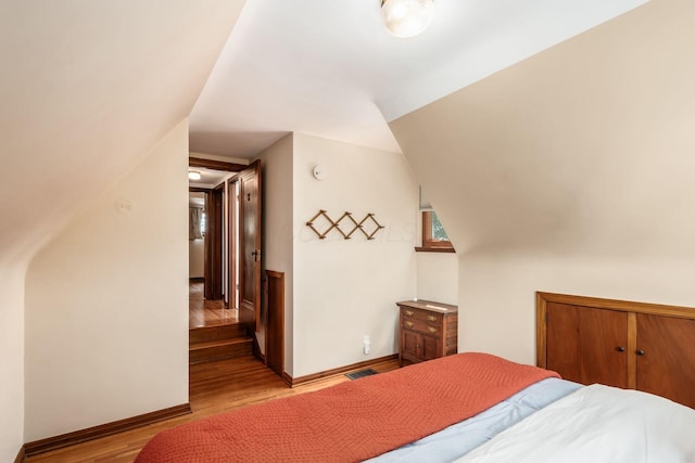 328 Chatham Rd, Columbus, OH 43214 - bedroom featuring wood finished floors and lofted ceiling