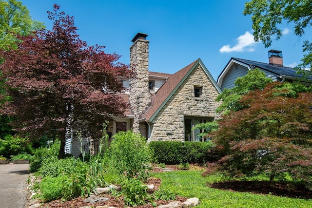 328 Chatham Rd, Columbus, OH 43214 - view of front facade featuring a chimney and stone siding