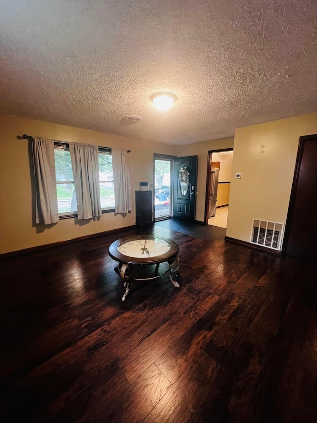 157 Saratoga Dr, Johnstown, OH 43031 - living area featuring a textured ceiling, wood finished floors, and baseboards