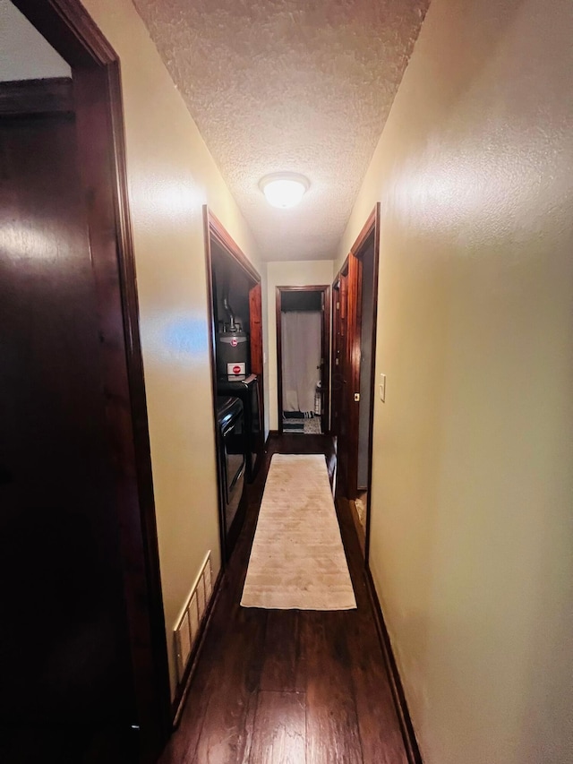 157 Saratoga Dr, Johnstown, OH 43031 - hall with a textured ceiling, dark wood finished floors, and baseboards