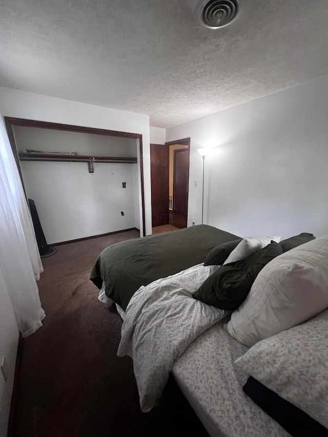 157 Saratoga Dr, Johnstown, OH 43031 - carpeted bedroom with a textured ceiling and a closet