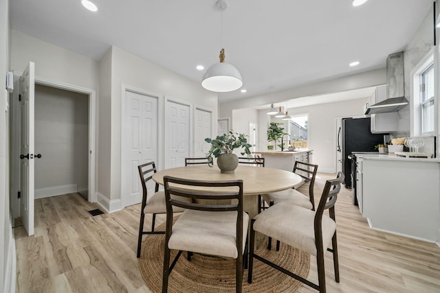 591 S 22nd St, Columbus, OH 43205 - dining area with light wood finished floors, healthy amount of natural light, and recessed lighting