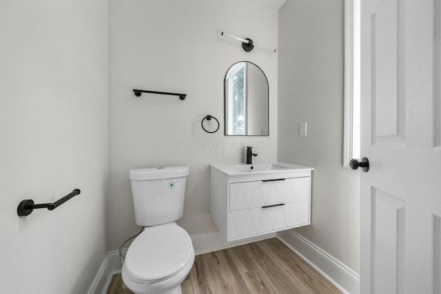 591 S 22nd St, Columbus, OH 43205 - half bathroom featuring vanity and wood finished floors