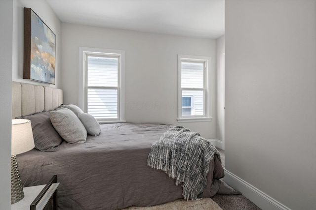 591 S 22nd St, Columbus, OH 43205 - bedroom featuring multiple windows and carpet flooring