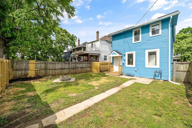 591 S 22nd St, Columbus, OH 43205 - back of house with a fire pit and a fenced backyard