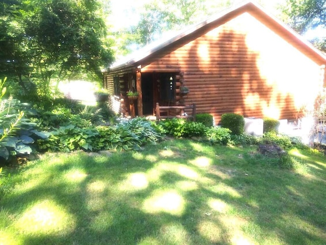 31280 Anglebrook Ln, Logan, OH 43138 - view of side of property with log siding and a lawn