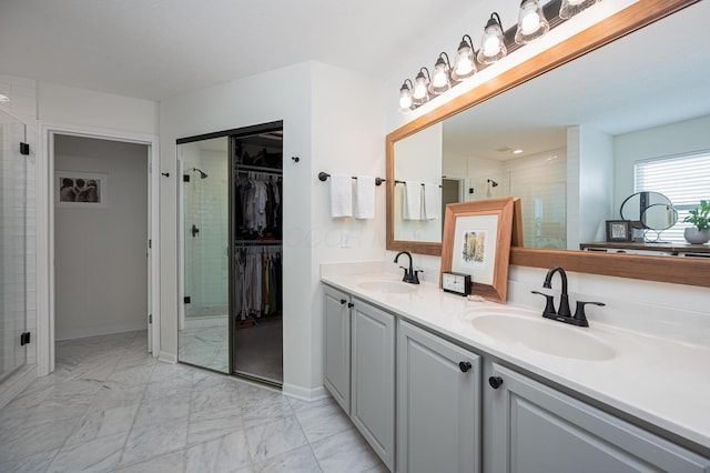 1355 Fisher Run Ct, Columbus, OH 43235 - full bath with double vanity, a tile shower, marble finish flooring, and a spacious closet