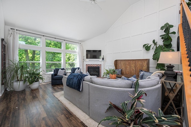 1355 Fisher Run Ct, Columbus, OH 43235 - living area with vaulted ceiling, dark wood-style flooring, and a brick fireplace