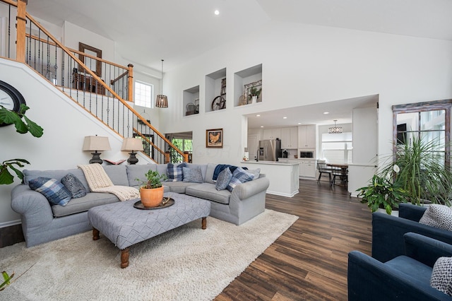 1355 Fisher Run Ct, Columbus, OH 43235 - living area with high vaulted ceiling, stairs, dark wood-style flooring, and recessed lighting