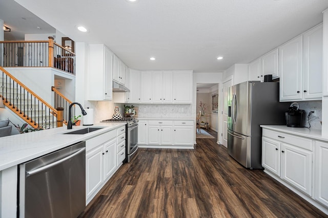 1355 Fisher Run Ct, Columbus, OH 43235 - kitchen with stainless steel appliances, dark wood-type flooring, backsplash, white cabinets, and recessed lighting