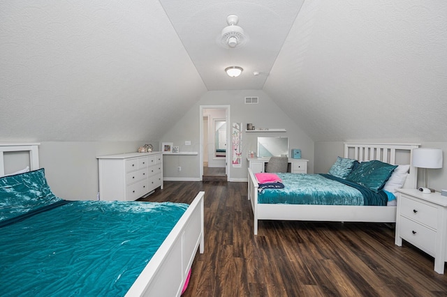 1355 Fisher Run Ct, Columbus, OH 43235 - bedroom featuring a textured ceiling, dark wood-style flooring, and lofted ceiling