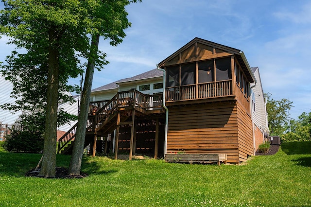 1355 Fisher Run Ct, Columbus, OH 43235 - back of house featuring stairs, a deck, a sunroom, and a yard