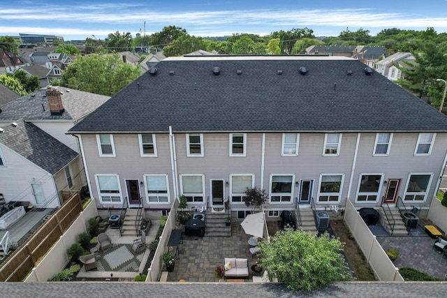 1098 Oregon Ave, Columbus, OH 43201 - back of property featuring a patio, entry steps, a fenced backyard, a residential view, and a shingled roof