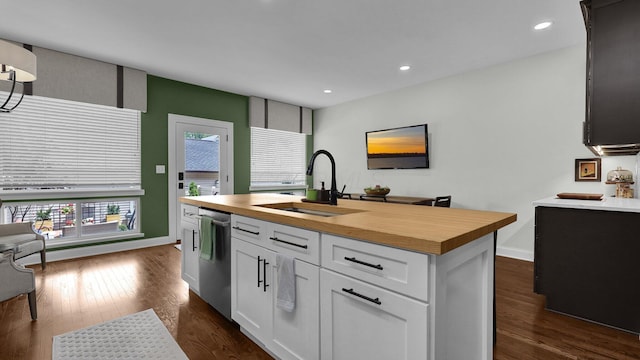 1098 Oregon Ave, Columbus, OH 43201 - kitchen with butcher block countertops, dishwasher, dark wood-style floors, white cabinetry, and plenty of natural light