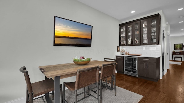 1098 Oregon Ave, Columbus, OH 43201 - dining space featuring wine cooler, dark wood-style floors, recessed lighting, and bar area