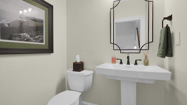 1098 Oregon Ave, Columbus, OH 43201 - half bathroom with toilet and baseboards