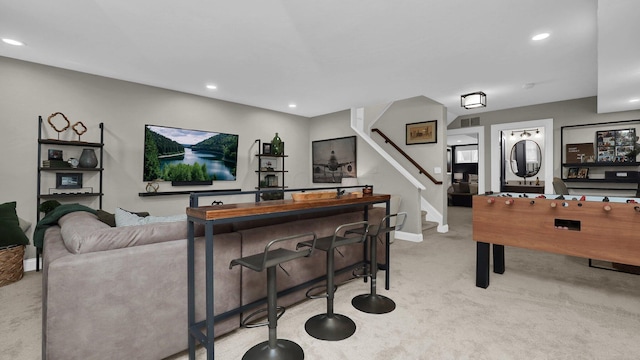 1098 Oregon Ave, Columbus, OH 43201 - carpeted living area featuring stairway and recessed lighting