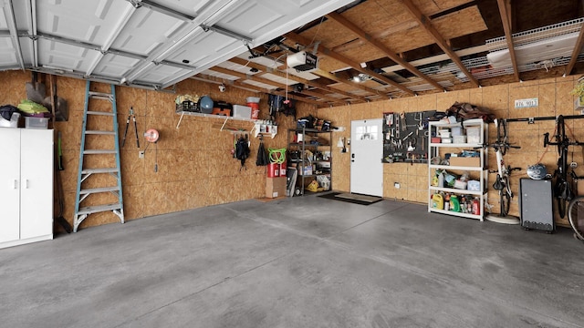1098 Oregon Ave, Columbus, OH 43201 - garage featuring a workshop area and a garage door opener