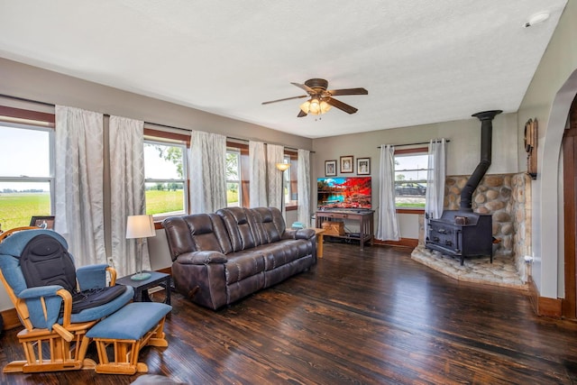 2380 Cedar Hill Rd SW, Amanda, OH 43102 - living area featuring a wood stove, wood finished floors, and a ceiling fan