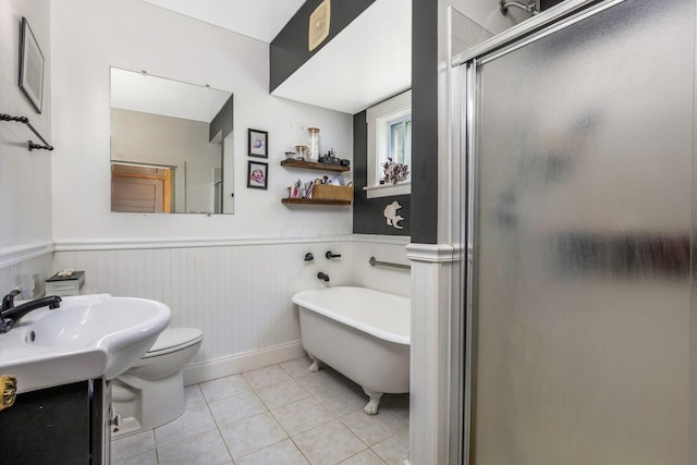 2380 Cedar Hill Rd SW, Amanda, OH 43102 - bathroom with a shower stall, tile patterned flooring, a freestanding bath, and a wainscoted wall