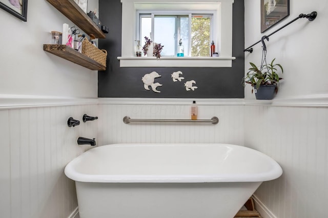 2380 Cedar Hill Rd SW, Amanda, OH 43102 - bathroom featuring a freestanding bath and a wainscoted wall