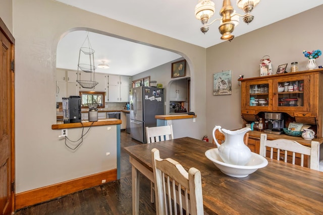 2380 Cedar Hill Rd SW, Amanda, OH 43102 - dining room featuring arched walkways, dark wood-type flooring, and a chandelier