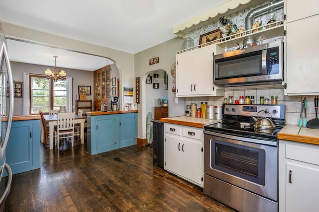 2380 Cedar Hill Rd SW, Amanda, OH 43102 - kitchen with stainless steel appliances, butcher block counters, a chandelier, and white cabinets