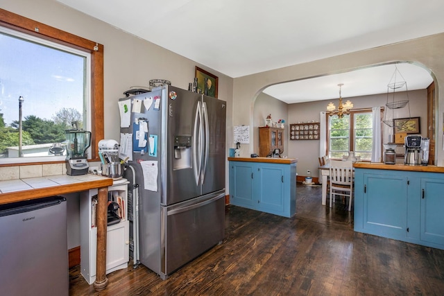 2380 Cedar Hill Rd SW, Amanda, OH 43102 - kitchen featuring stainless steel fridge, stainless steel refrigerator, blue cabinets, and arched walkways