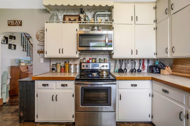 2380 Cedar Hill Rd SW, Amanda, OH 43102 - kitchen with appliances with stainless steel finishes, tasteful backsplash, and white cabinetry