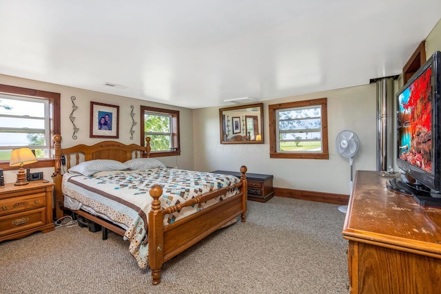 2380 Cedar Hill Rd SW, Amanda, OH 43102 - bedroom with light carpet and a wood stove