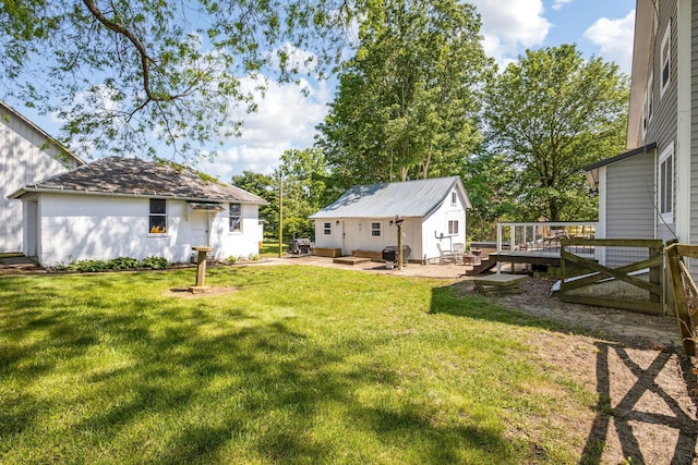 2380 Cedar Hill Rd SW, Amanda, OH 43102 - view of green lawn with a wooden deck, an outbuilding, and a patio area
