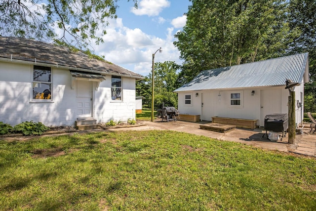 2380 Cedar Hill Rd SW, Amanda, OH 43102 - back of house featuring a lawn and a patio area