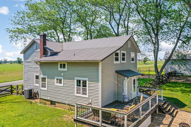 2380 Cedar Hill Rd SW, Amanda, OH 43102 - rear view of house featuring a deck, a metal roof, a lawn, and a chimney